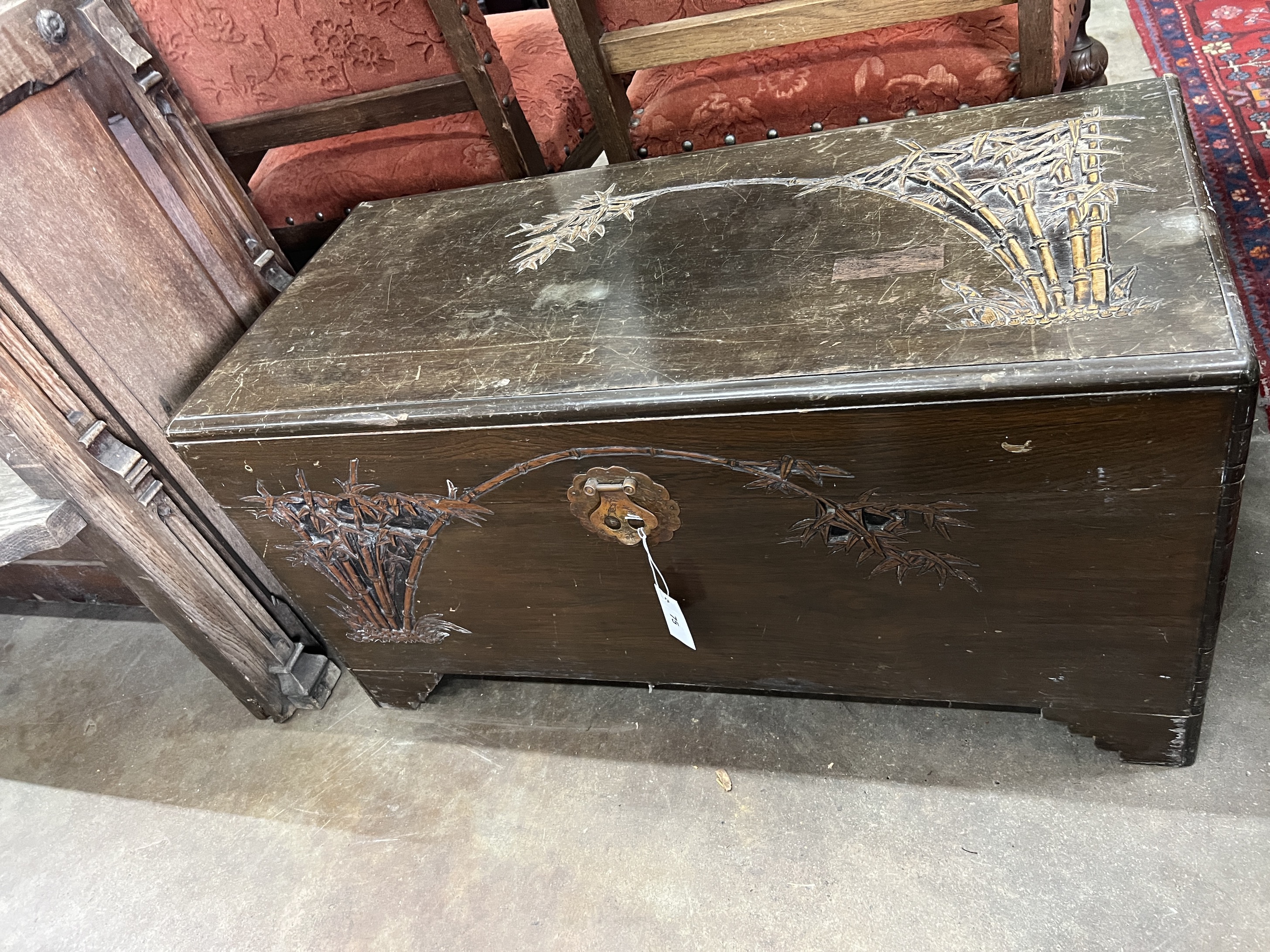 A Chinese carved camphorwood trunk, width 93cm, depth 44cm, height 48cm